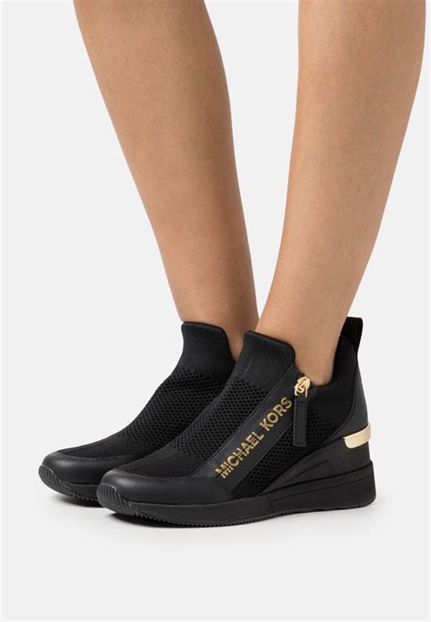 michael kors trainer black|Michael Kors black wedge sneakers.